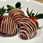 chocolate dipped strawberries with white drizzle