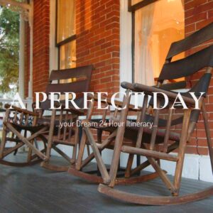 A perfect day in Parkville begins on this porch: wooden rocking chairs, a round iron table, and golden-hour views at Main Street Inn.