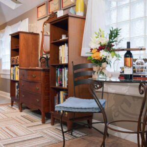 Cozy corner of the Missouri River Suite featuring the bed, window seating, and curated décor - a perfect honeymoon suite in kansas city