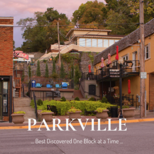 Walkable downtown Parkville Missouri with local shops, restaurants, and historic buildings at street level