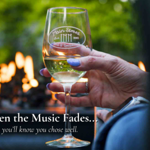 Guest enjoying a glass of wine by the fire after a concert near Morton Amphitheater in Parkville Missouri