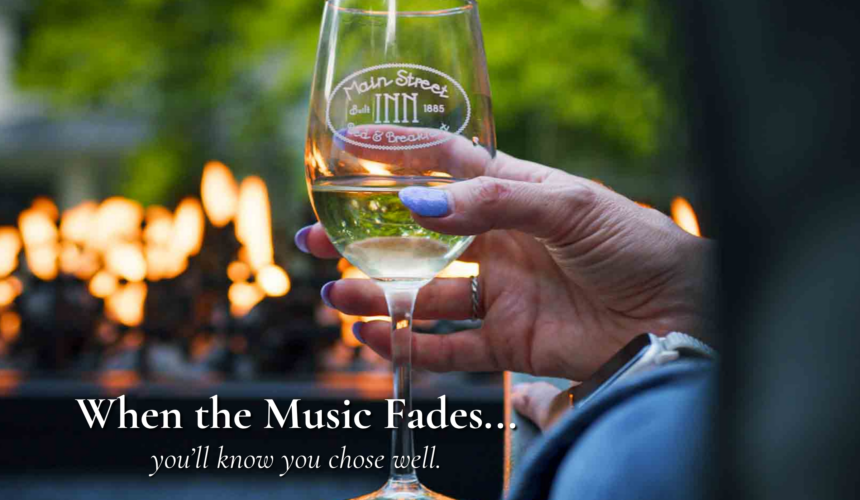 Guest enjoying a glass of wine by the fire after a concert near Morton Amphitheater in Parkville Missouri