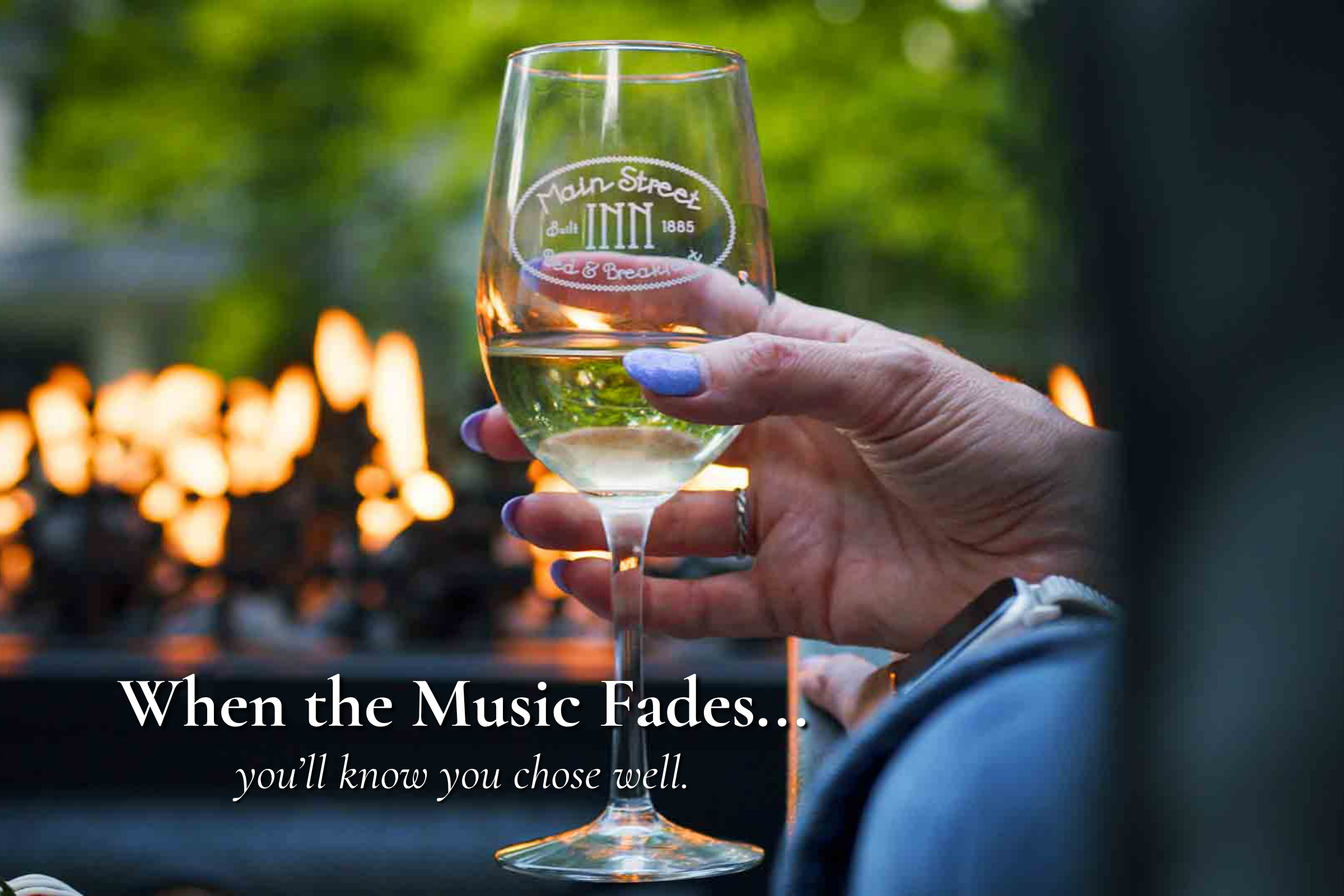 Guest enjoying a glass of wine by the fire after a concert near Morton Amphitheater in Parkville Missouri