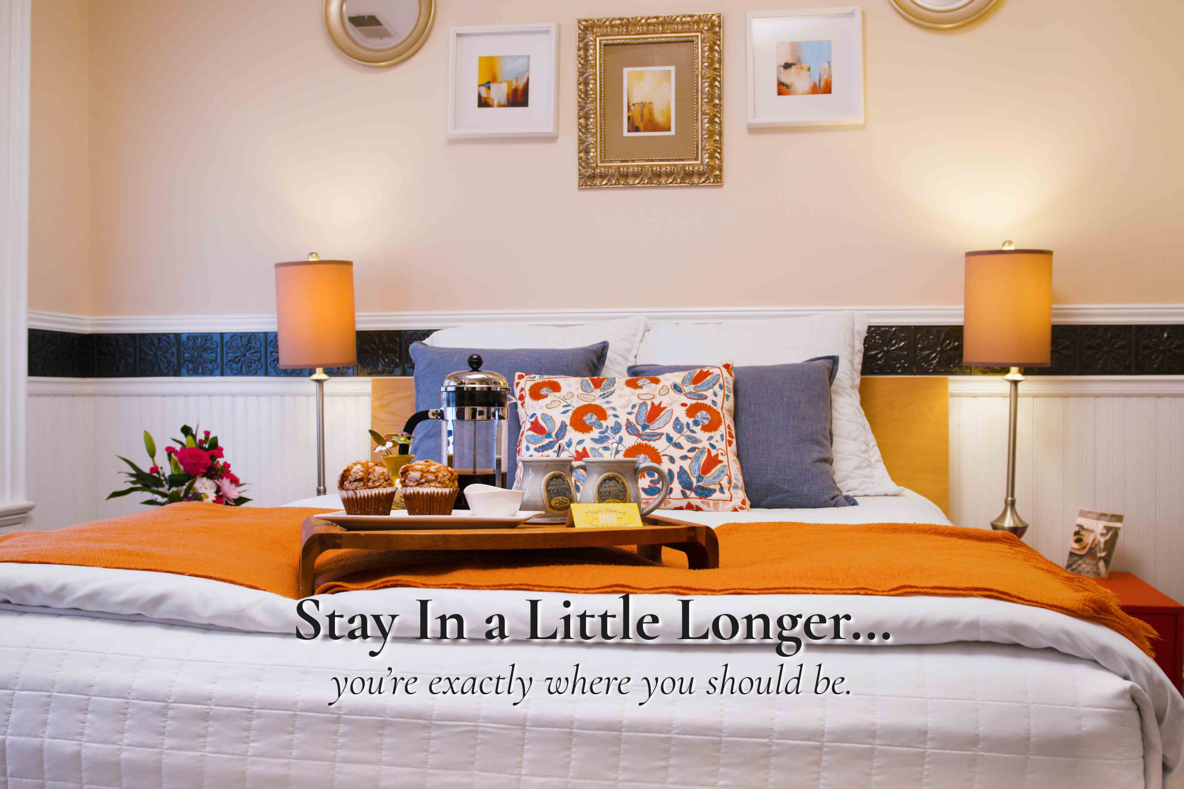 Cozy guest room with breakfast tray at Main Street Inn in Parkville Missouri near Morton Amphitheater